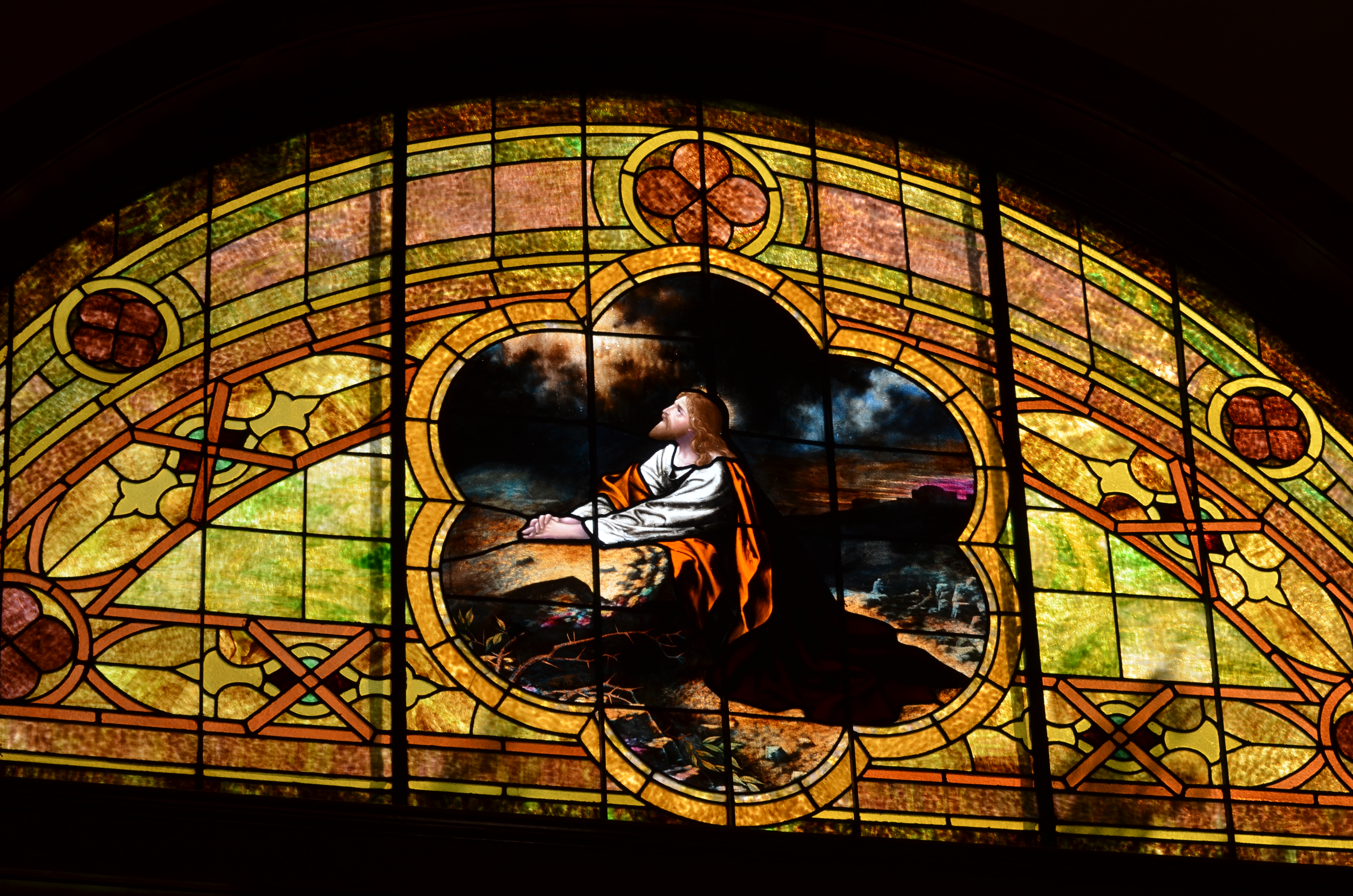 East facade window with Christ detail