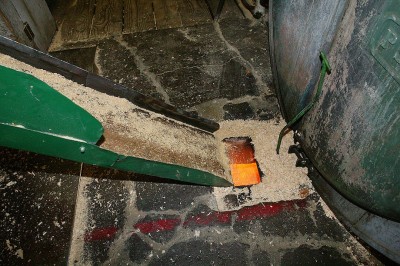 Debris fed into furnace below boiler, Hull-Oakes Lumber Mill, Feb. 2011.
