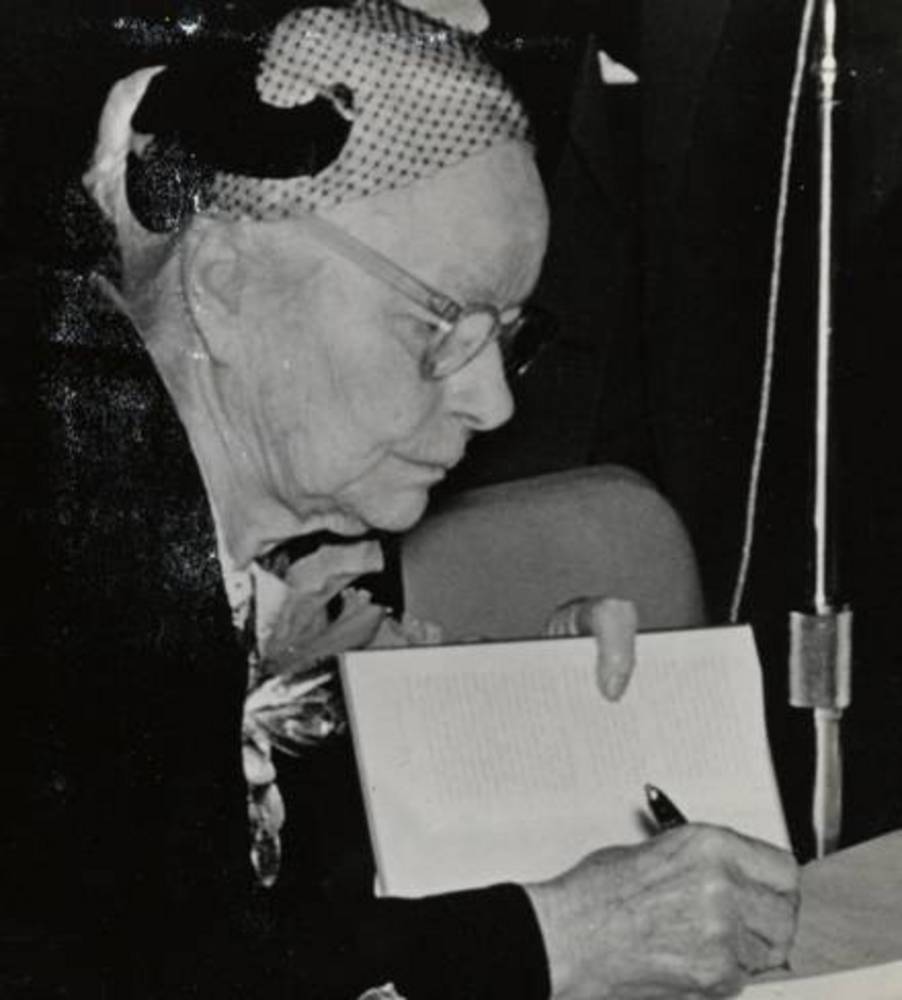 Esther Pohl Lovejoy signing her book, Women Doctors of the World, about 1957.