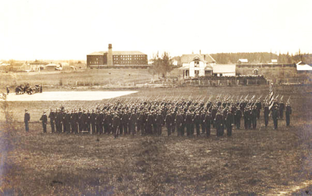 OAC Cadets with Carriage Factory in background, 1901.