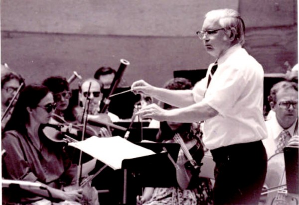 Dr. Charles Heiden conducting at the 1981 Oregon Coast Music Festival.