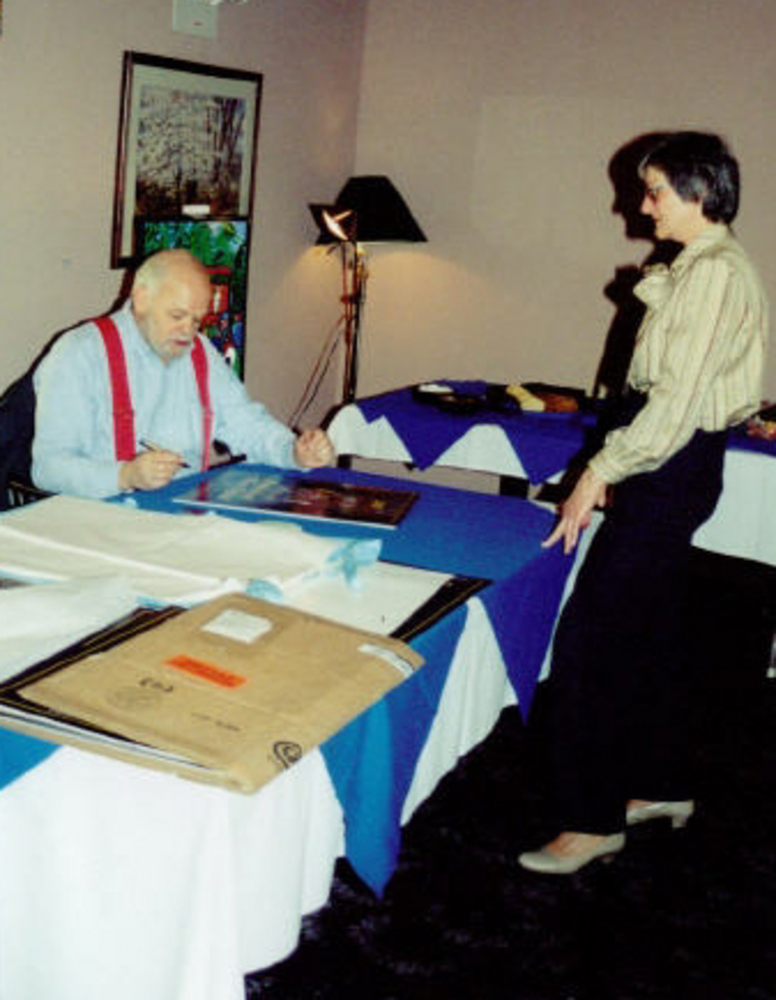 Oregon Coast Music Association poster artist Jerry Baron (seated), 2000.