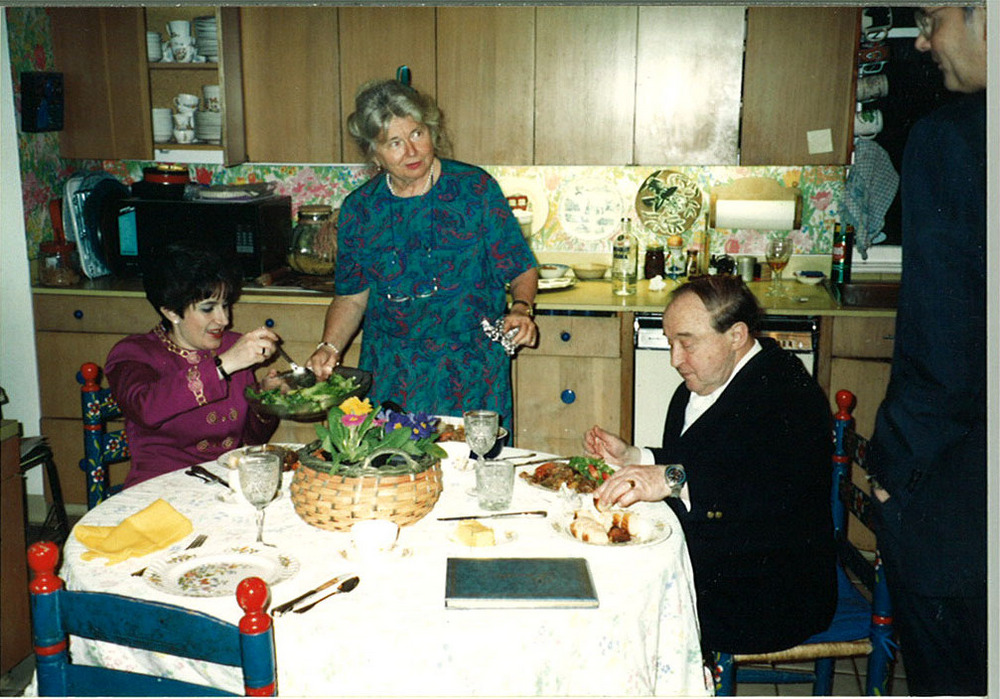 Betty Perkins (standing) entertains Beaux Arts Trio members Menahem Pressler (right) and Ida Kavafian in her kitchen, about 1991.