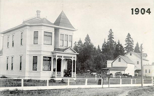 Martin Thompson built this house in 1904. Sophia at fence, Martin at mill.