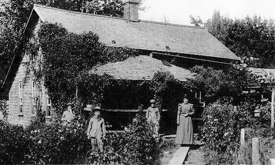 Members of the Thompson Family outside original house built about 1863.