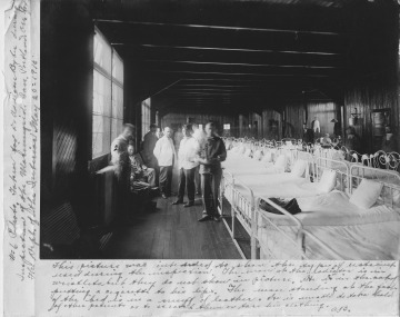 Patients' arms are restrained during a visit by inspectors.