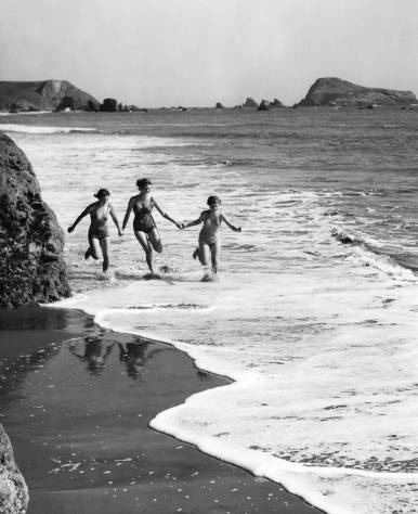 Racing the waves near Brookings, 1930s.