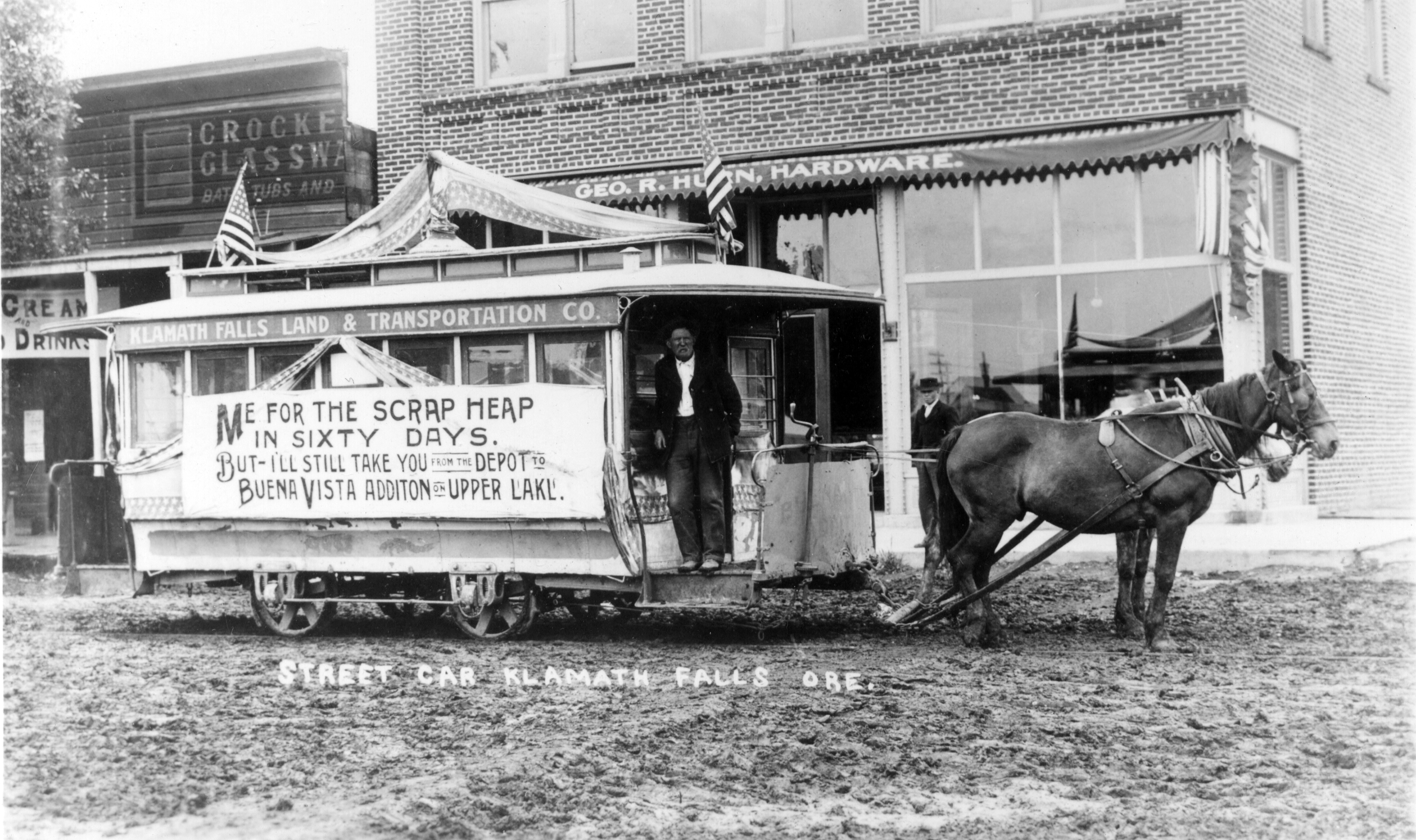 Klamath Land and Transportation Co. car headed east on Main St., July 4, 1910.