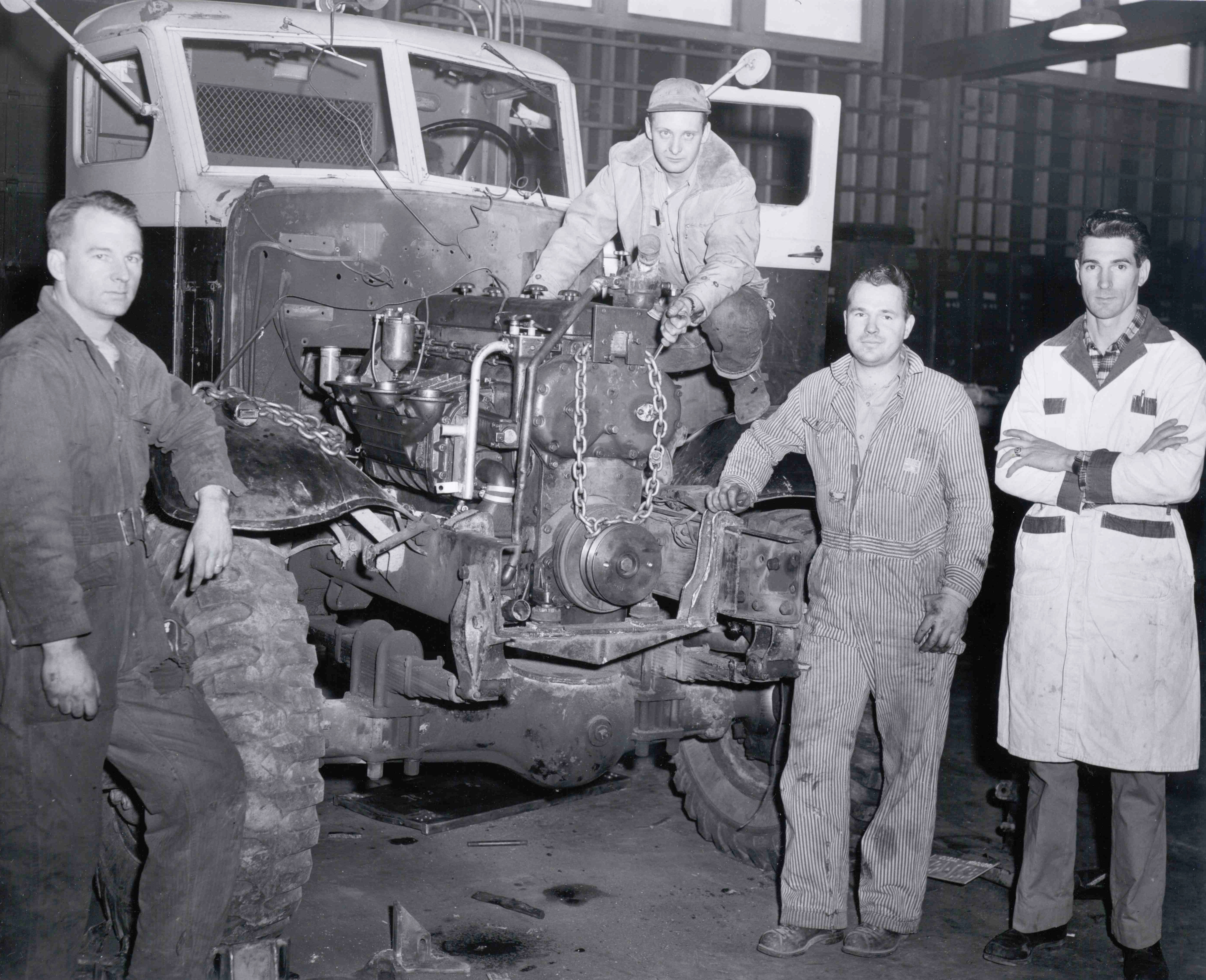 Students and instructor in automotive technology class, 1950s.